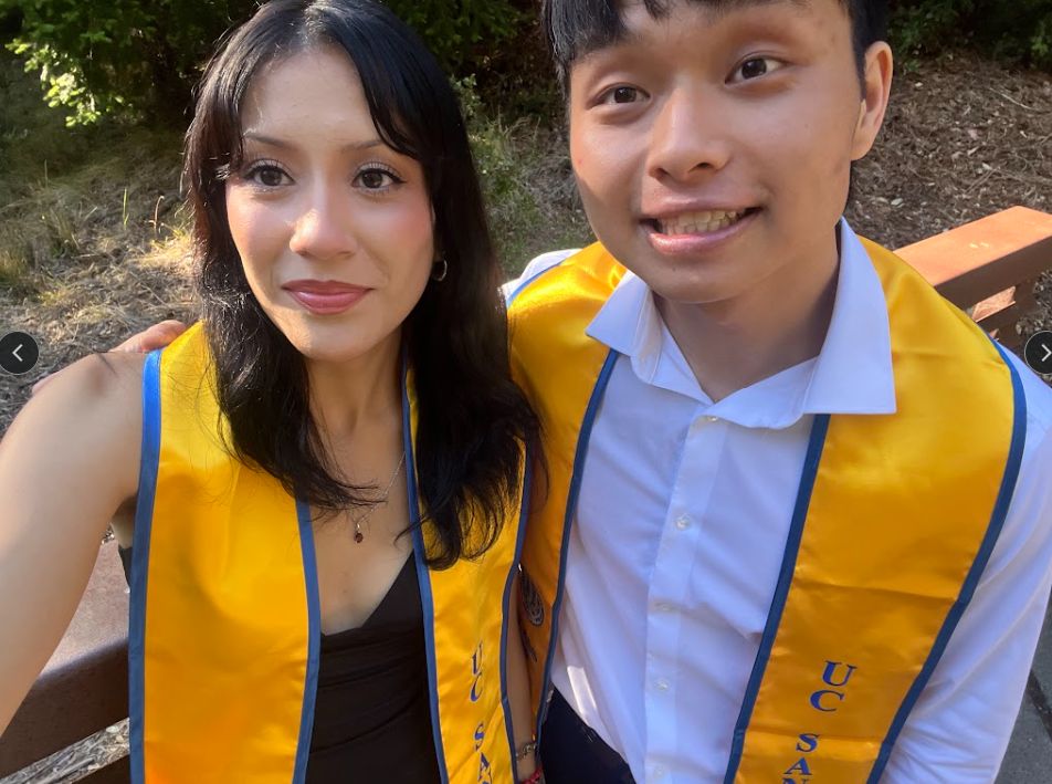 Luc Tran celebrating graduation with a friend