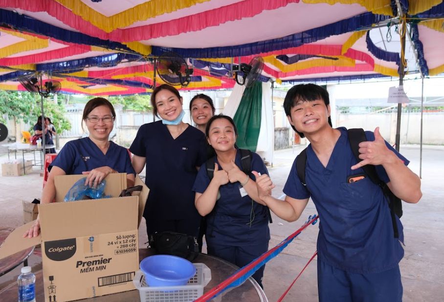 Luc Tran with a volunteer dental team